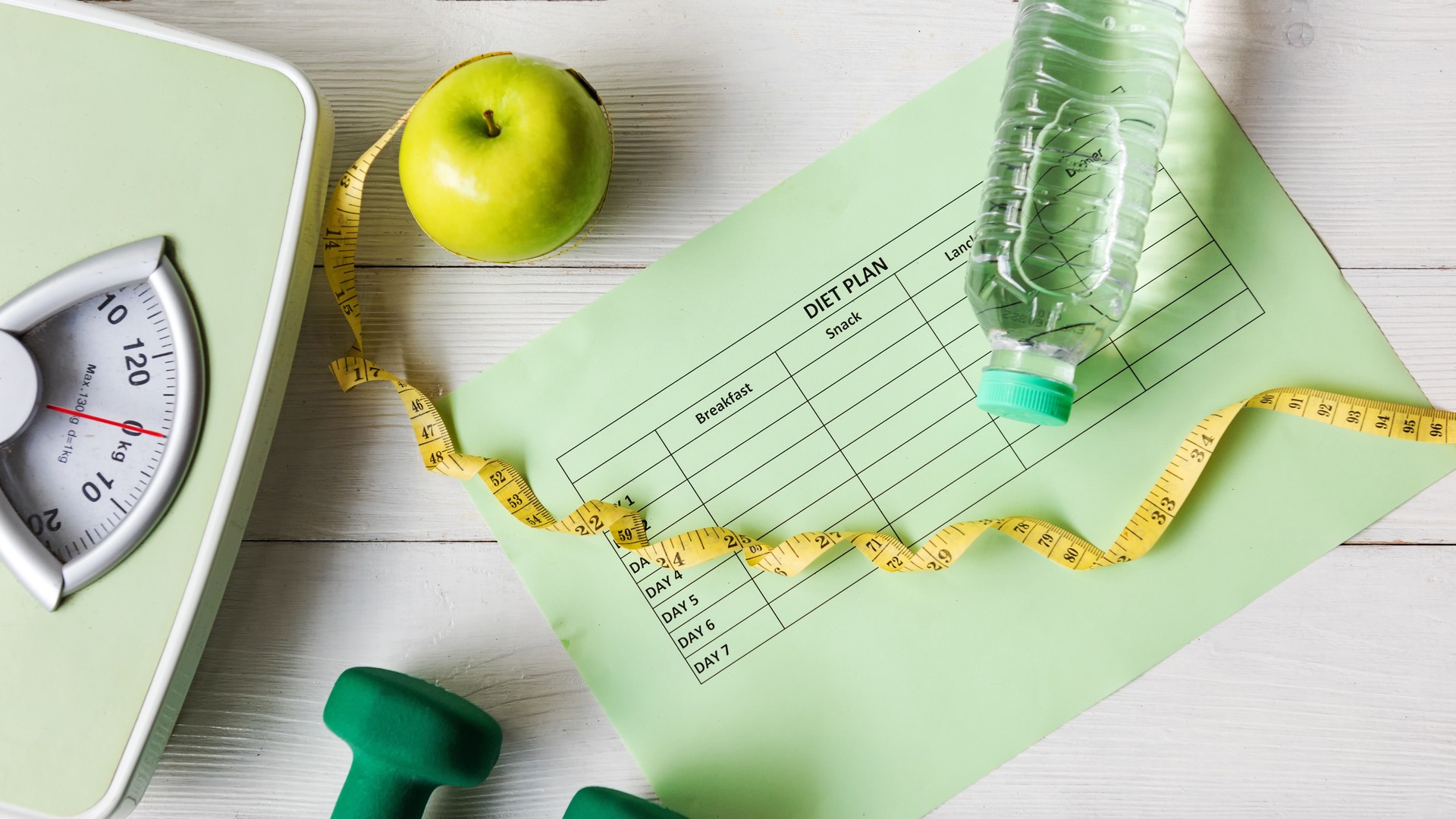 Diet Health Plan. Workout planing. Sport exercise equipment workout and gym background with nutrition fresh salad for fitness style. Healthy Lifestyle Concept